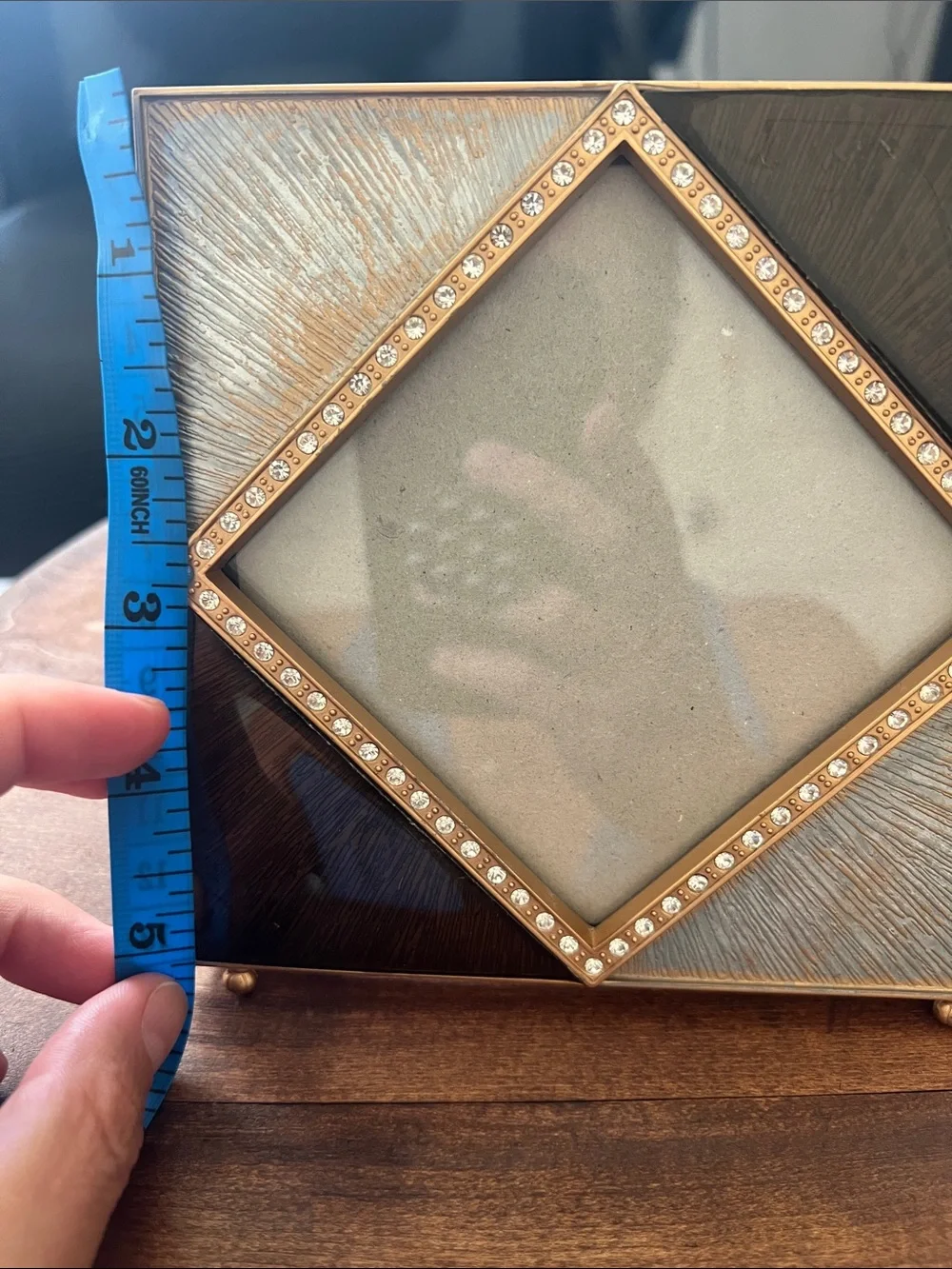 Z Gallerie picture frame features an enamel and crystal-decorated diamond border